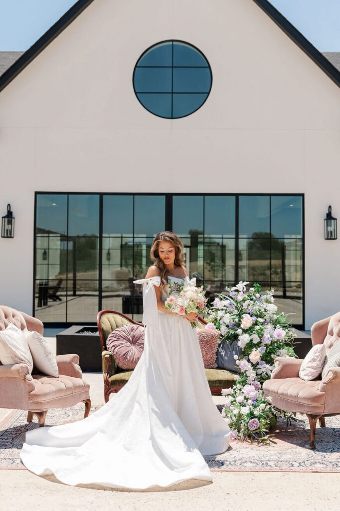 Bridal picture with decorated lounge set in front of Wedding Venue DFW