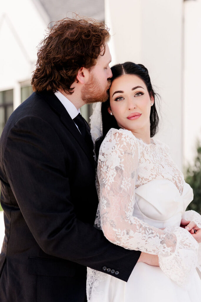 Bride and Groom are kissing at Grace Manor Wedding Venue