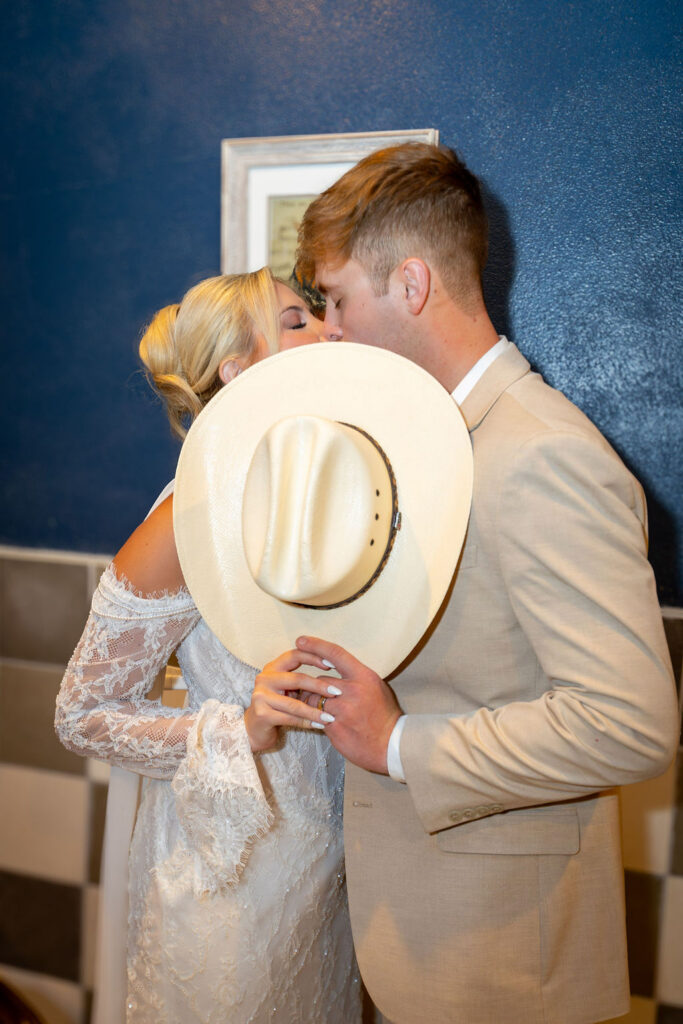 Jazz Chapel Wedding Venue close up kiss with hat
